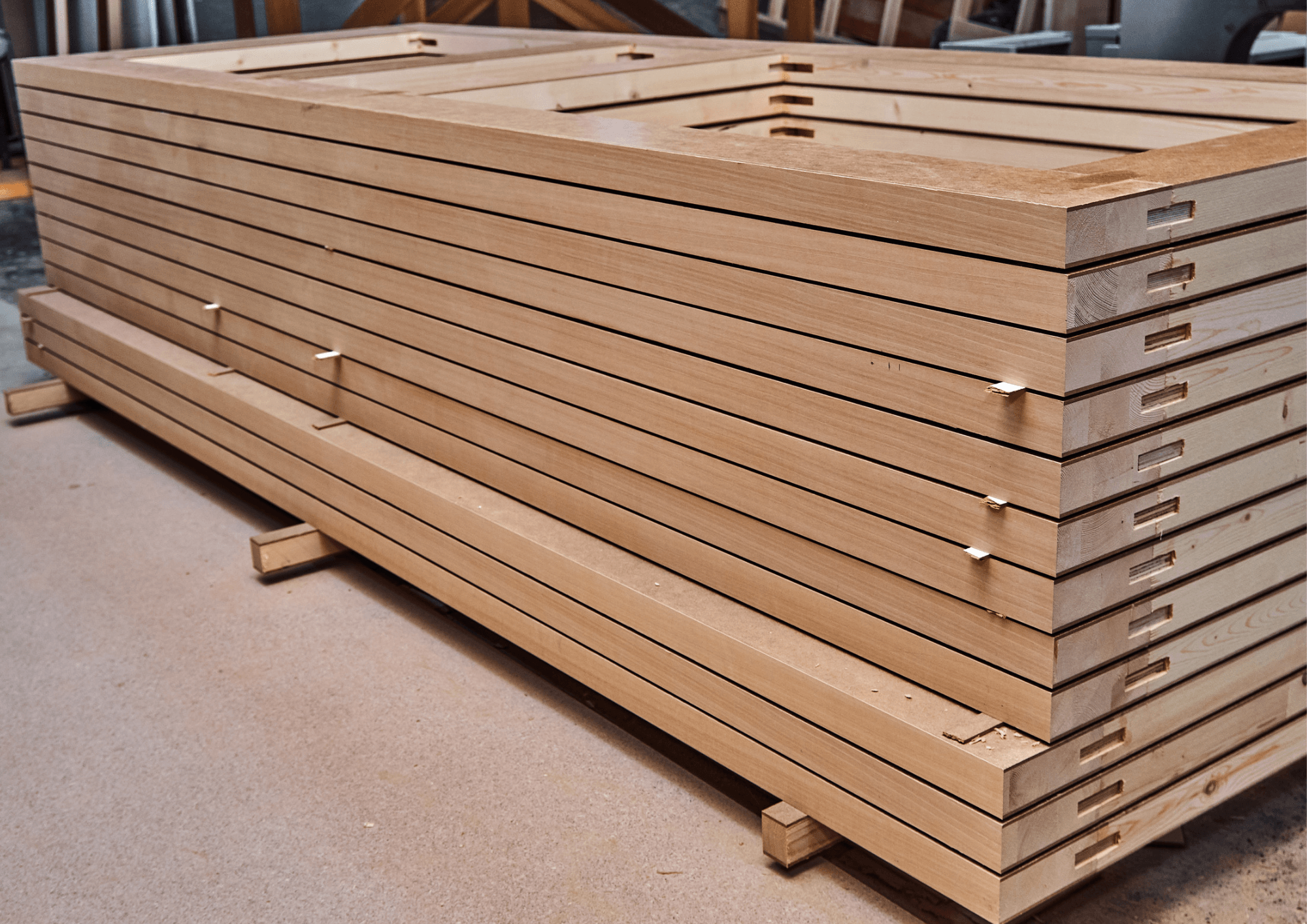 A custom door shop floor, where a specification has to travel accurately between the customer, the sales rep and the machinists building it.